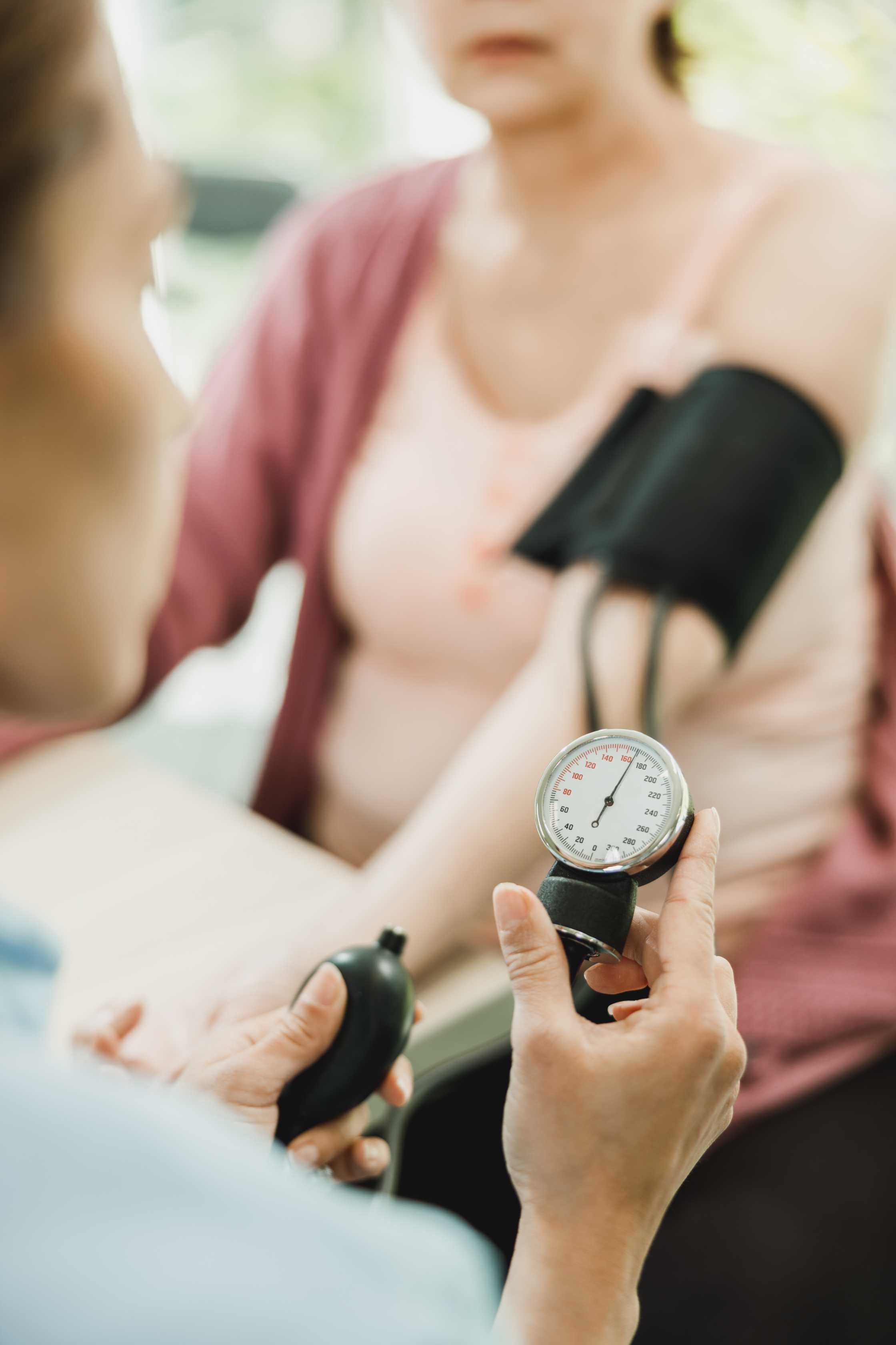 close-up-nurse-checking-blood-pressure-senior-woman.jpg