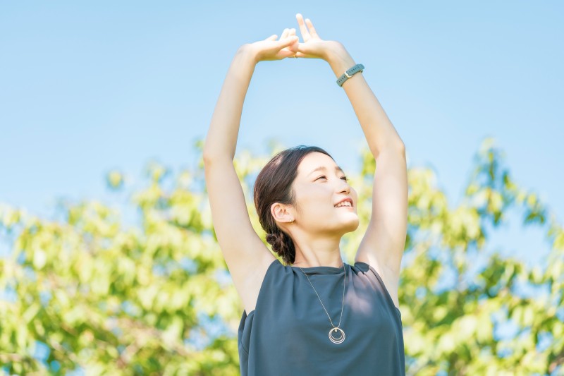 asian-young-woman-relaxing-green.jpg
