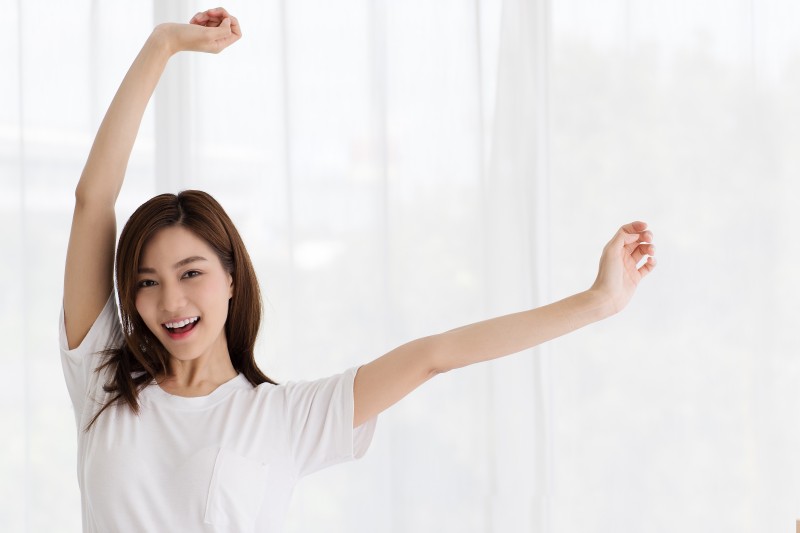 portrait-beautiful-cute-young-asian-woman-smiling-with-self-confident-graceful-manner-she-raises-her-hand-touch-her-chin-with-friendly-pose-white-curtains.jpg