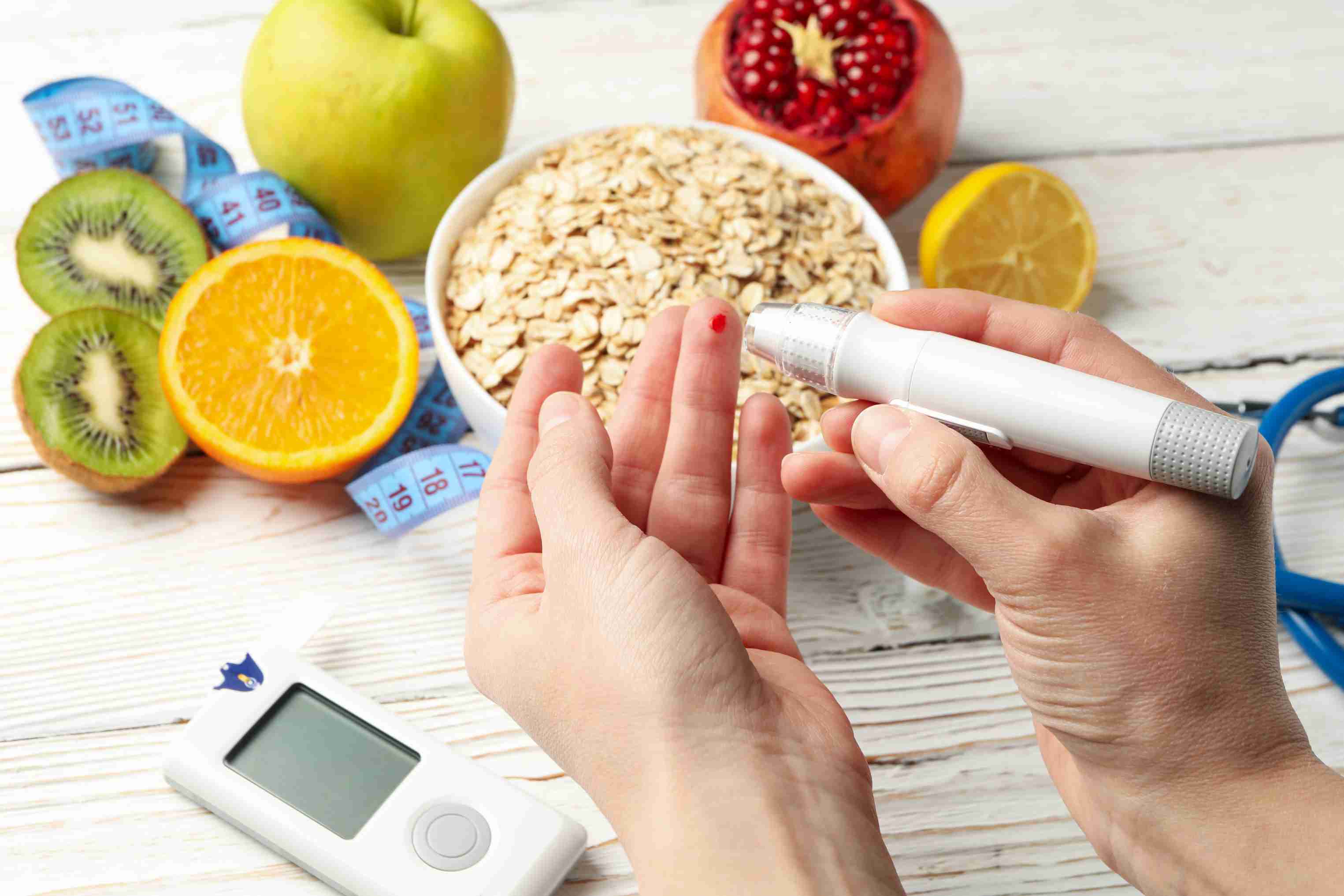 female-checking-blood-sugar-level-table-with-diabetic-accessories.jpg