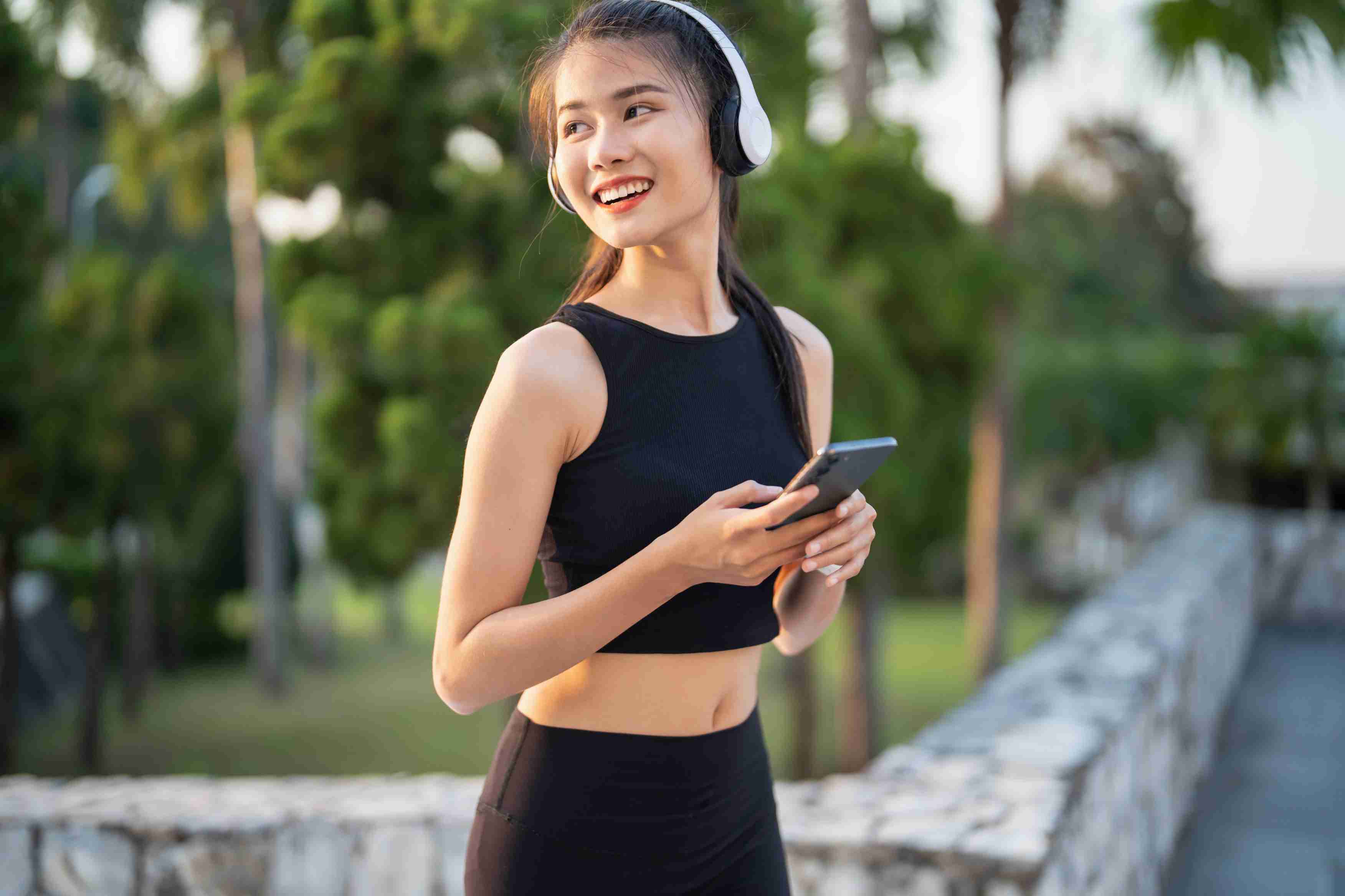 happy-active-healthy-asian-woman-listening-music-with-headphones-mental-health-listening-audio-running-inspiration.jpg