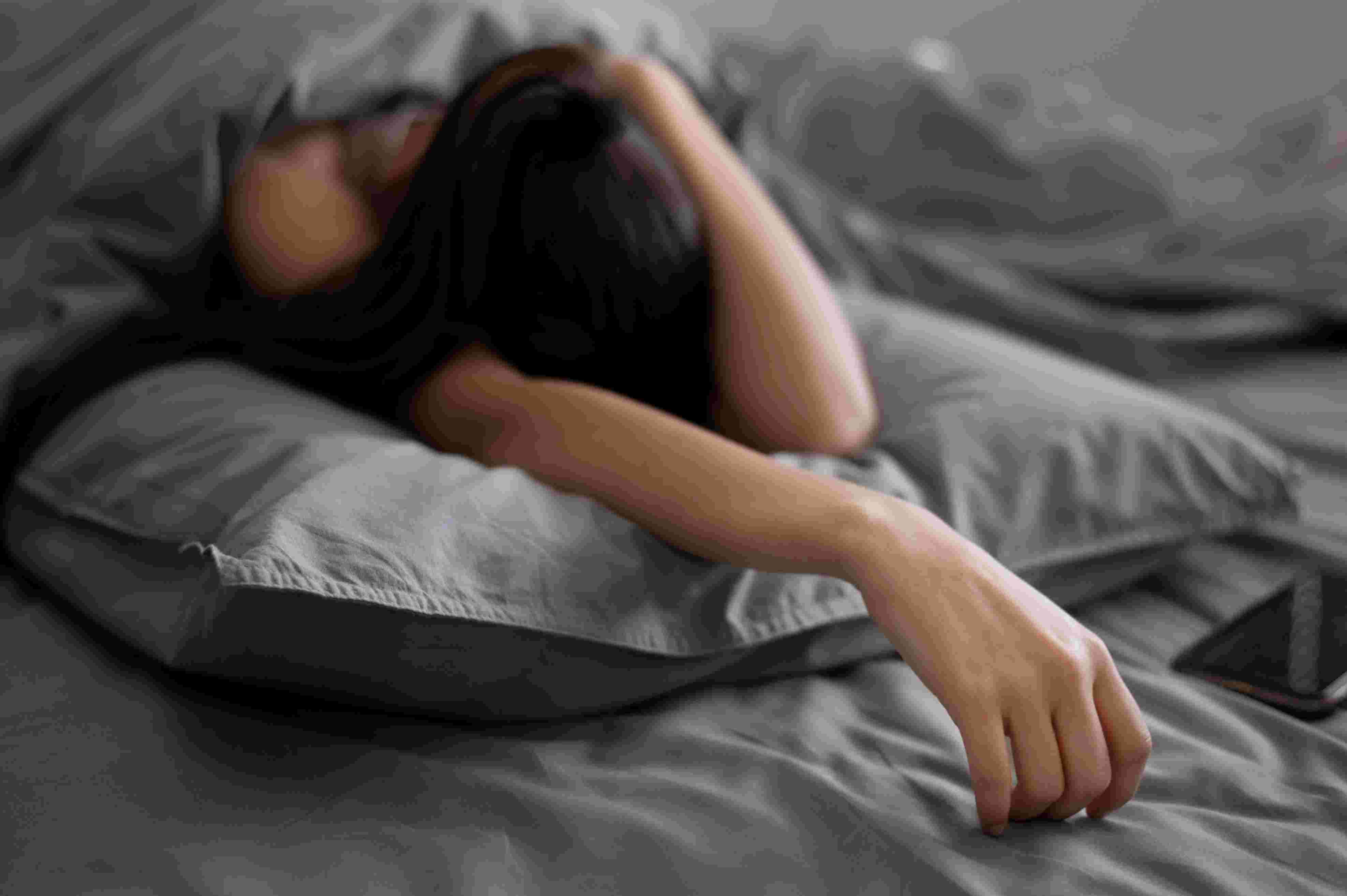 medium-shot-depressed-woman-bed.jpg